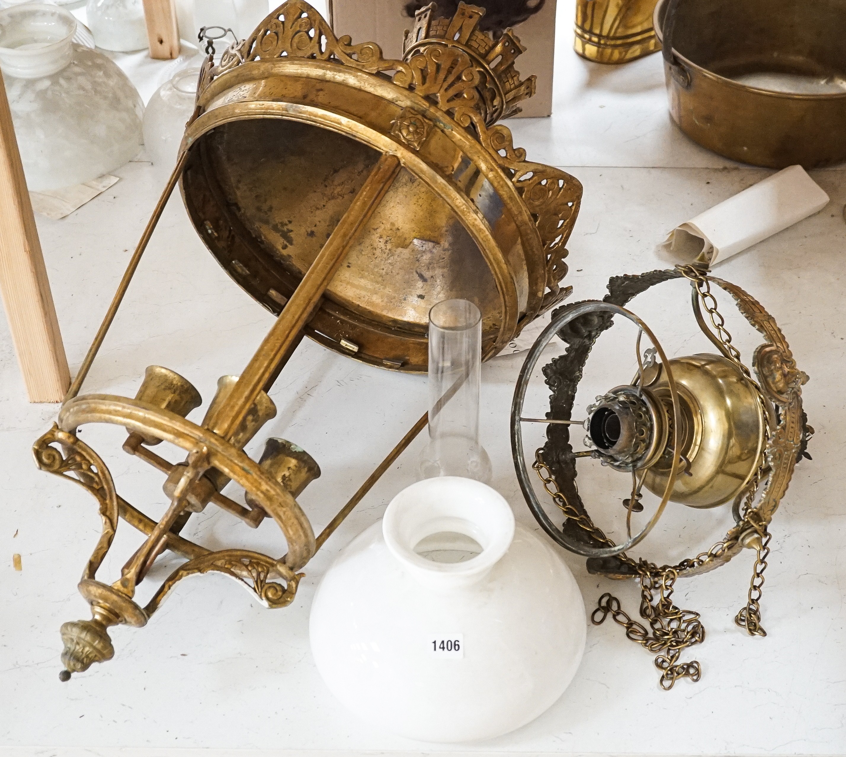 An Edwardian brass hanging oil lamp with opaque shade, overall drop 80cm Together with a large brass hall lantern